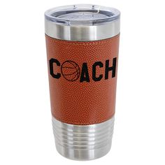 an orange leatherette tumbler cup with the word coach on it and a basketball inside