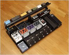 an assortment of electronic equipment sitting on top of a wooden floor