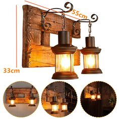 three lights hanging from the side of a wooden wall with chains attached to it and an image of wood planks behind them