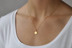 "Our gift to you 10% off your first purchase. Details here - http:/eepurl.com/dpVPBz Our dainty sun necklace in gold or silver is sure to brighten your day. This sun pendant necklace moves freely on a delicate but sturdy chain. Wear this tiny sun charm as a layering piece or alone as a simple statement necklace. DETAILS Necklace features a 1/2\" 24 k gold plate or sterling silver sun charm pendant 14 k gold fill or sterling silver chain dainty but sturdy chain This listing is for one sun necklac Bold Gold Necklace, Simple Statement Necklace, Xo Necklace, 14k Gold Initial Necklace, Sun Jewelry, Necklace Sun, Diamond Initial Necklace, Dainty Diamond Necklace, Sun Charm