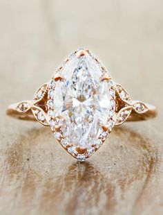 an engagement ring with a pear shaped diamond in the center