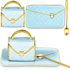 three pieces of blue and gold purses on plates with spoons, fork and utensils