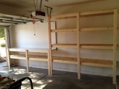 the inside of a garage with shelves in it