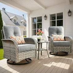 two chairs and a table on a porch