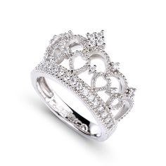 Delicate and romantic, this crown-shaped ring will utterly delight the queen of your heart. Fashioned in sleek sterling silver, this ring features open hearts and sparkling stones. Twinkling round stones, meaningful hearts and milgrain detailing complete this lovely style. A regal choice for your princess, this ring creates a romantic look. Carat Weight: 0.762 ctStone Size: 1.1,1.25,1.5 mmStone Type: Jeulia® StoneNumber of Stones: 31 Stone Color: Diamond WhiteStone Shape: RoundWeight: 5.63 gWidt Sterling Silver Crown Shaped Elegant Rings, Luxury Crown Design Cubic Zirconia Rings, Elegant Sterling Silver Crown Ring, Elegant Rings With Crown Design, Luxury Cubic Zirconia Rings With Crown Design, Luxury White Gold Rings With Crown Design, Luxury White Gold Ring With Crown Design, Elegant Round Crown Anniversary Ring, Silver Jewelry With Structured Crown Design