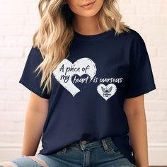 Show your support with our "A Piece of My Heart is Overseas" United States Navy Family Shirt, featuring the US Navy logo. Perfect as a gift for a proud Navy mom or Navy wife, this tee is a heartfelt way to support our troops and celebrate your US seaman. Explore our US military gift ideas for the perfect US seaman tee today! Please let me know if you have any questions. We love custom order requests!! All designs can be put on sweatshirts, hoodies, tanks, mugs, just send me a message! Additional Us Navy Logo, Proud Navy Mom, Navy Families, Military Gift, Navy Wife, Navy Mom, Navy Logo, Support Our Troops, Military Gifts