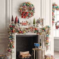 a fireplace decorated with christmas decorations and ornaments