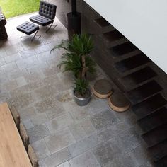 an overhead view of a living room with stairs