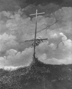 a cross on top of a hill with clouds in the background