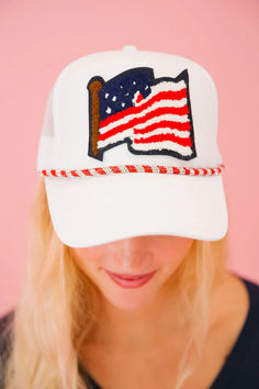 Add a patriotic touch to your wardrobe with this white trucker hat featuring a bold American flag patch. The silver and red rhinestone band adds a touch of sparkle. Plus, the adjustable back ensures a perfect fit. Show off your American pride in style! Cheap Patriotic Snapback Trucker Hat, White Cap For Memorial Day, Adjustable White Hat For 4th Of July, White Baseball Cap Trucker Hat For 4th Of July, White Baseball Cap For 4th Of July, White Trucker/basbeall Cap For 4th Of July, Patriotic White Baseball Cap With Curved Bill, Patriotic White Trucker Hat/baseball Cap, Patriotic White Trucker Hat