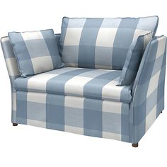 a blue and white checkered chair with two pillows on the arm, sitting in front of a white background