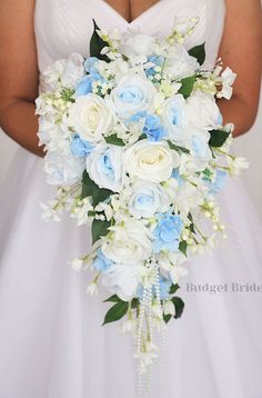 a bridal holding a bouquet of white and blue flowers