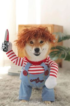 a dog dressed up as a clown holding a knife in its mouth and wearing overalls