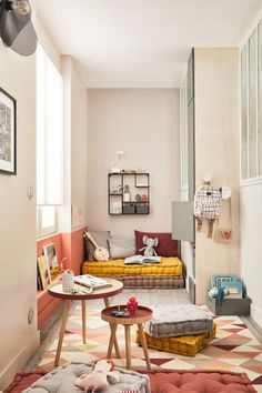 a living room filled with lots of furniture and decor