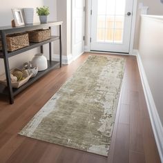 a large rug is on the floor in front of a door and shelf with baskets