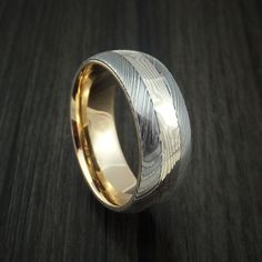 Damascus Steel and Mokume Ring with Yellow Gold Sleeve Wedding Band Custom Made Damascus Mens Rings, Formal Etched Round Band Jewelry, Etched White Gold Jewelry With Round Band, Etched Round Band Promise Jewelry, White Gold Etched Promise Ring, Etched Round Promise Ring, White Gold Jewelry With Brushed Finish For Formal Occasions, Formal White Gold Jewelry With Brushed Finish, Modern Etched Jewelry For Anniversary