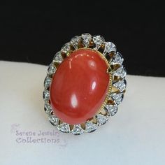 This pretty Levian red Coral Ring is set in 14k solid gold and is surrounded by a diamond halo!Ring Size: 5.75Total Weight: 8.45 gramsPrecious Metal: 14k solid goldPrecious stones:-Coral Center Stone: 19.3mm x 14.1mm, 10.1 carats-White Round diamonds: 0.2 ctHallmark: 14K, HK Red 14k Stamped Cluster Ring, Red Cluster Ring Stamped 14k, Fine Jewelry Red Diamond Ring Stamped 14k, Red Diamond Cluster Ring For Formal Occasions, Formal Red Diamond Cluster Ring, Red 14k Gold Cluster Ring For Formal Occasions, Formal Red 14k Gold Cluster Ring, Anniversary Red Cluster Ring Stamped 14k, Red Oval Diamond Halo Ring