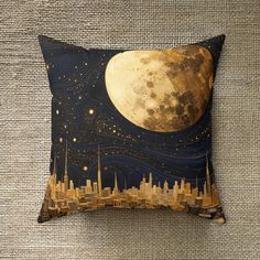 a pillow with a cityscape and the moon in the sky on top of it