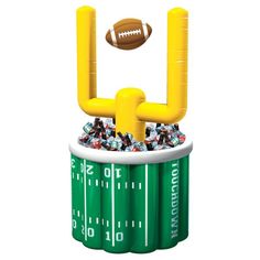 an inflatable football stadium cooler filled with confetti and candy for the super bowl