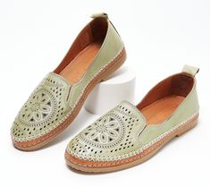 These leather slip-ons boast an intricately designed, perforated upper that demands attention. Whether you choose to wear them with your go-to jeans, a cute maxi dress, or shorts during those warm summer months, they're destined to radiate your sense of style for all to enjoy. From Spring Step. Spring Flat Heel Slip-ons With Perforations, Leather Slip-ons With Woven Sole For Spring, Spring Slip-ons With Perforations And Flat Heel, Spring Perforated Flat Heel Slip-ons, Comfortable Leather Slip-ons For Spring, Spring Green Slip-ons With Rubber Sole, Summer Slip-ons With Stitched Sole And Flat Heel, Summer Leather Slip-ons With Perforations, Green Slip-ons With Textured Sole For Spring