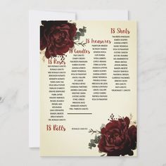 a wedding seating chart with red flowers on it's back and white paper in front