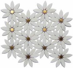 white flowers with gold centers are arranged in the shape of a heart on a white background