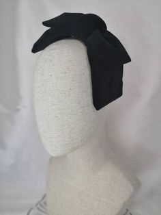 1950s/1960s inspired, this gorgeous velvet double bow is handmade from a dense cotton velvet, giving it a lovely structure without being stiff. Attaches with 2 combs, metal headband or hat elastic in black or cream. ***Please note that the headband is a standard adult size and isn't suitable if you have a small head and/or fine/short hair. I would recommend choosing the hat elastic. Combs are good for thicker hair. If you're unsure of what attachment to go for drop me a message and I'll do my be Retro Headpieces For Party, Elegant Bow Headband As Gift, Fitted Mini Hat With Bow For Party, Adjustable Bow Fascinator For Formal Occasions, Fitted Retro Party Headpieces, Chic Formal Fascinator With Bow, Elegant Party Headband With Decorative Bow, Fitted Bow Headpiece For Kentucky Derby, Formal Bow Headpiece For Kentucky Derby