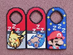 three nintendo themed bottle openers are on the carpet