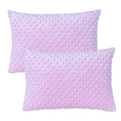 two pink pillows with white polka dots on the front and back, one in light purple