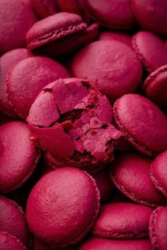 red macaroons are shown in close up