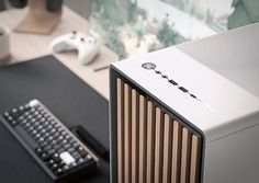 a desktop computer sitting on top of a desk next to a keyboard