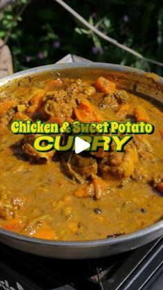 chicken and sweet potato curry in a pan on top of an electric stove with the words chicken & sweet potato curry