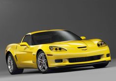 a yellow sports car is shown in this image