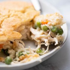 a white plate topped with chicken pot pie