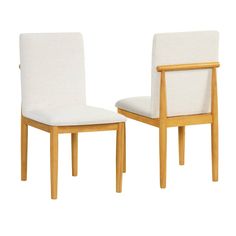 a pair of white chairs sitting next to each other on top of a white floor