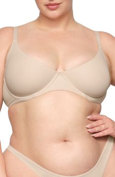 Enjoy the comfort of a bralette while retaining the support of an underwire with this comfortable everyday option. Available in many different shades, this second-skin bra is updated with a straighter, bonded neckline with no stitching to allow the 360º stretch fabric to lay flat against your skin. Adjustable straps 80% polyamide, 20% elastane Hand wash, dry flat Imported lined Supportive Underwire Bra In Beige, Medium Bust Support No-show Bra, No-show Padded Bra, Supportive Solid Nursing Bra With Padded Cups, Supportive Padded Solid Nursing Bra, Supportive Beige Bra, Beige Underwire Seamless Bra, Beige Seamless Underwire Bra, Classic Underwire Bra With Soft Touch