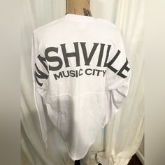 Nwot Brand: Spirit Jersey Size: Medium Color: White Long Sleeve Shirt Reads “Nashville Music City” Tags: Bachelorette, Country, Concert Cotton Tops For Fall Music Festival, White Long Sleeve Top For Concert, White Top For Fall Concert, Nashville Music City, Music City Nashville, Nashville Music, Long Sleeve Workout Top, Baseball Tee Shirts, Leopard Print Shirt