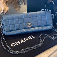 Rare And Exquisite Chanel Classic Quilted Lambskin Bag In A Beautiful Deep Teal Blue. Single Flap With Cc Turn Lock Closure. Two Chain Link Straps. Front Strap Is Accented By Pearls. Silver Hardware. Height Is 5 Inches. Length Is 11 Inches. Width Is 2 Inches. Strap Drop Is 12 Inches. This Bag Is In Pristine Condition And Is Very Rare And Very Hard To Find. Comes With Box And Dust Cover. Deep Teal, Selling On Poshmark, Quilted Bag, Dust Cover, Free Items, Bago, Luxury Items, Silver Hardware, Teal Blue