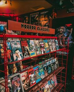 there are many movies on display in the store