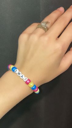 A pink, yellow, and blue bracelet that says swag (: Kpop Style Personalized Multicolor Bracelets, Personalized Multicolor Kpop Style Bracelets, Multicolor Kpop Jewelry For Friendship, Kpop Style Personalized Multicolor Jewelry, Personalized Multicolor Kpop Style Jewelry, Casual Multicolor Name Bracelet For Friendship, Casual Customized Pink Name Bracelet, Trendy Multicolor Name Bracelet, Customized Multicolor Kpop Bracelets