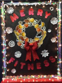 a christmas card with the words merry fitness on it and a wreath made out of balls