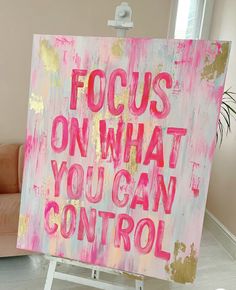 a pink and gold painting with the words focus on what you can control