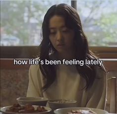 a woman sitting at a table with plates of food in front of her and the words how life's been feeling lately