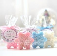 three snowflake soaps are sitting next to each other on a white surface