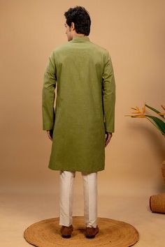 Green kurta with quilted embroidery on left and right side. Paired with a cotton silk churidar. - Aza Fashions Green Long Sleeve Cotton Churidar, Transitional Long Sleeve Cotton Churidar, Fitted Cotton Kurta With Traditional Drape, Fitted Cotton Sherwani With Traditional Drape, Transitional Green Cotton Churidar, Festival Cotton Handloom Churidar, Festival Handloom Cotton Churidar, Transitional Cotton Churidar With Traditional Drape, Transitional Season Cotton Sherwani With Traditional Fit