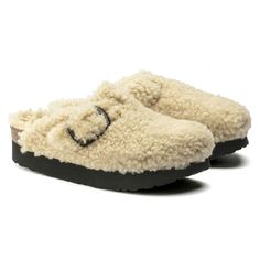 Boston Big Buckle Casual Shearling Slip-on Mules, Casual Winter Shearling Mules, Winter Shearling Clogs With Cushioned Footbed, Casual Shearling Clogs With Round Toe, Winter Beige Closed Toe Clogs, Winter Slip-on Clogs With Leather Footbed, Winter Leather Footbed Slip-on Clogs, Winter Clogs With Textured Footbed And Round Toe, Winter Closed Toe Clogs With Textured Footbed