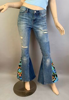 Vintage 70s style up-cycled Allsaints jeans with vintage fabric gussets added. Distressed vintage look denim jeans size 26 low waist tight fit jeans. True waist 26 Low waist 29 Hip 32 Inseam 31 inches Rise 8 Waist to hem 39 Stretch Denim Jeans For Festival, Fitted 70s Inspired Cotton Flare Jeans, Festival Stretch Denim Jeans, 70s Inspired Fitted Flare Cotton Jeans, Summer Patchwork Denim Flare Jeans, Retro Stretch Flare Jeans, Fall Festival Denim Flare Jeans, 70s Inspired Fitted Flare Jeans For Spring, Spring Patchwork Flare Jeans