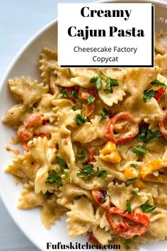 creamy cajun pasta with tomatoes and parsley in a white bowl on a table