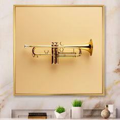 a brass trumpet mounted to the wall