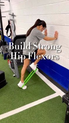 a woman standing on top of a bench in a gym with the words build strong hip flexors